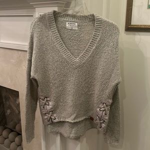 One Teaspoon oatmeal sweater with crisscross side embellishment. Size XS